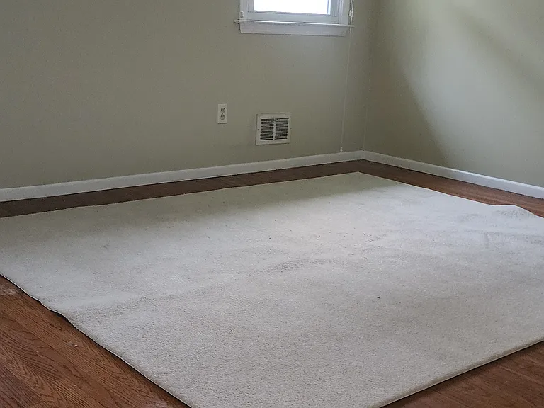 Large main bedroom. There is a closet with sliding doors and closet organization. There are two windows in this room facing back yard.