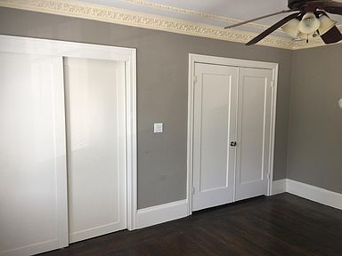 Bedroom, closet door on the left. Door to hallway on the right.