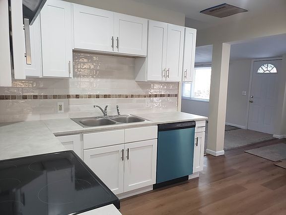 Renovated kitchen open to Renovated dining and living room area