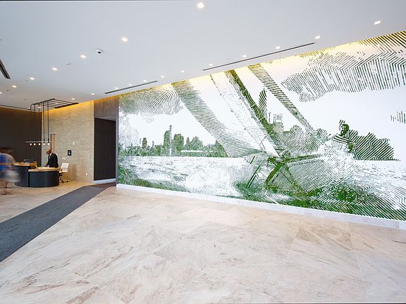 24-hour attended lobby featuring a curated art display