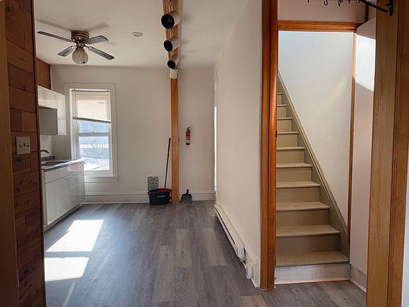 Kitchen area and steps to attic bedroom