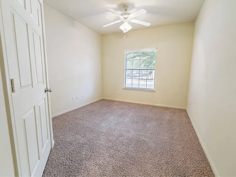 Bedroom with a ceiling fan Stonehaven Apartments in Houston, TX