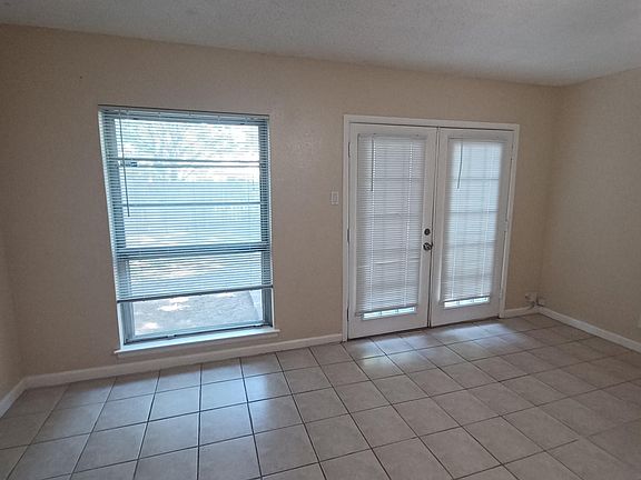 living room , exit to back patio