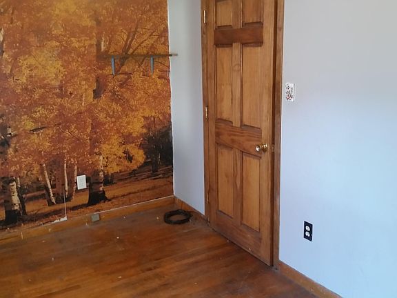Bedroom with hardwood flooring