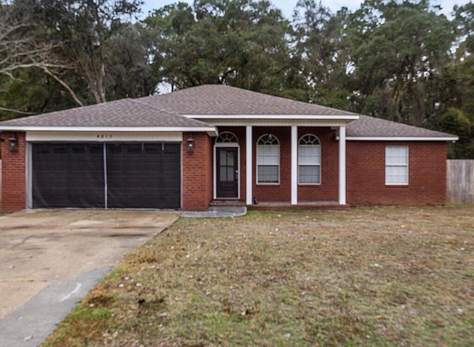 Brick exterior with porch, and screened garage cover