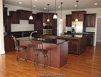 Gourmet Kitchen Two Large Granite Islands. All upgraded stainless applainces!