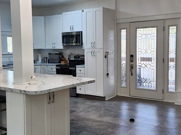 KITCHEN LOOKING TOWARD FRONT DOOR