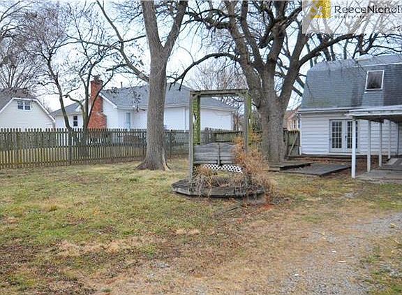 Large backyard with covered swing and 2 deck areas