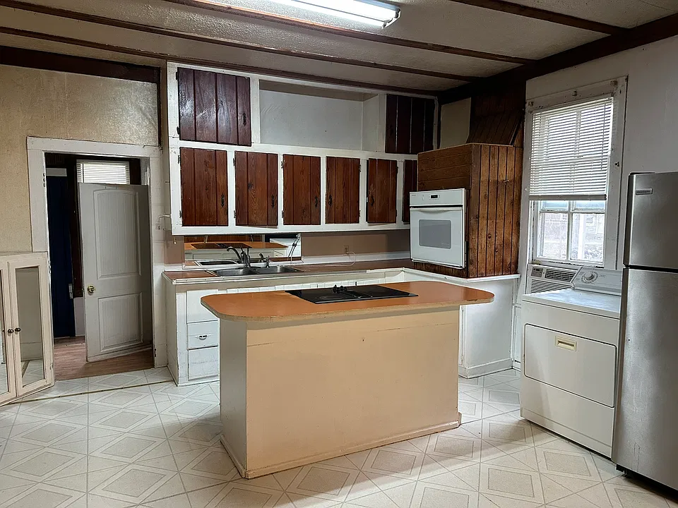View from Middle room looking towards Kitchen.
