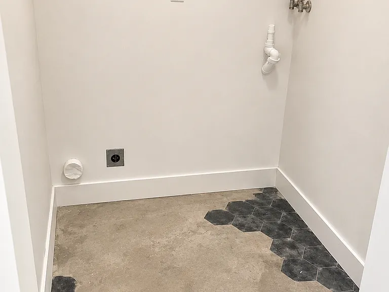 Artist laundry room floor with beautiful boot ties and polished concrete