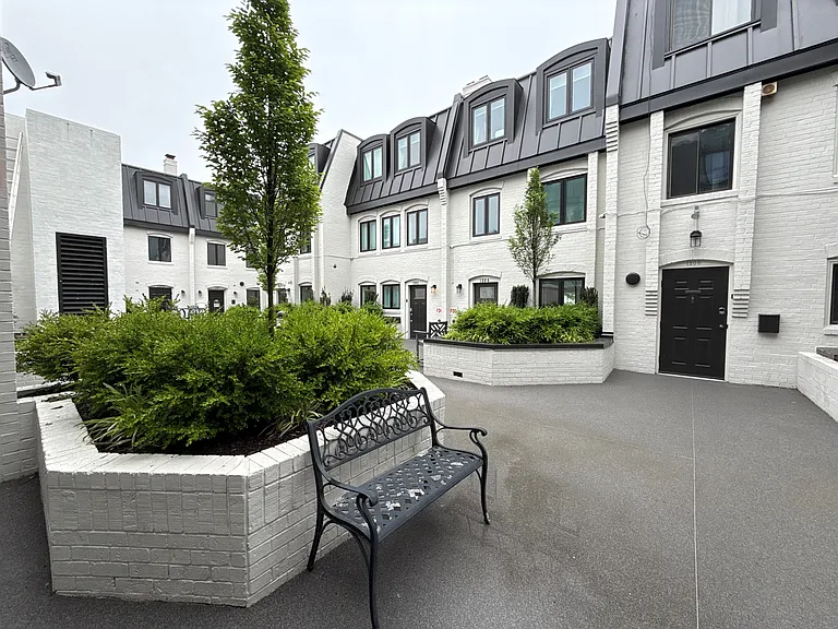 view from the front door of the condo to the patio in the center of the Eton Court gated complex.