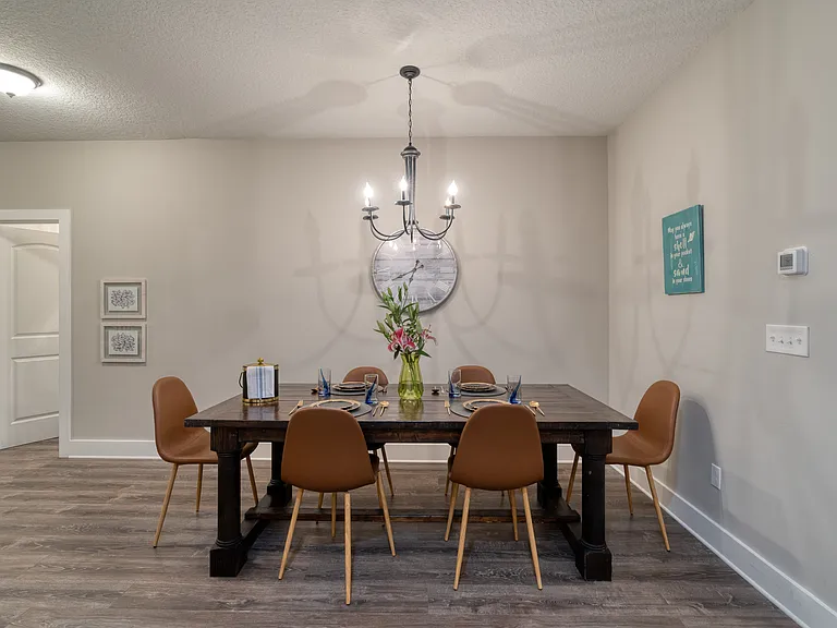 Gather everyone around our large, rustic wooden dining table for memorable family dinners or lively vacation game nights