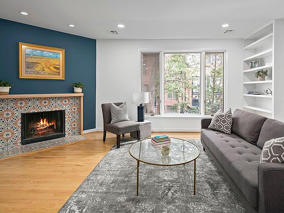 Tile surround of fireplace matches kitchen flooring