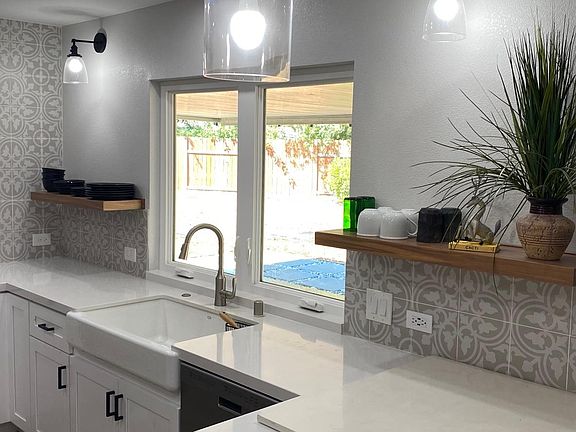 Large kitchen casement windows with a view to the beautiful back yard