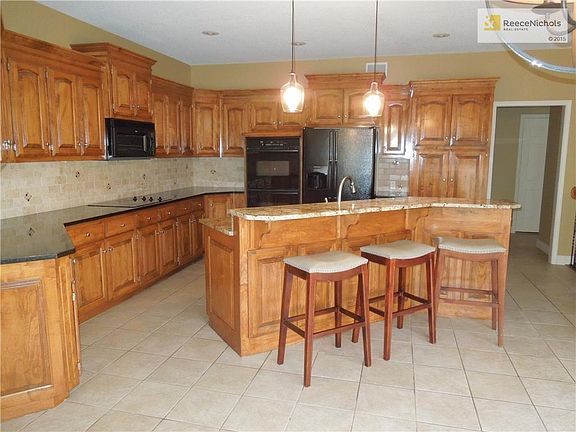 Look at all the counter space this kitchen offers. Pantry with pull out shelves as well as some other cabinets with the pull out shelves.