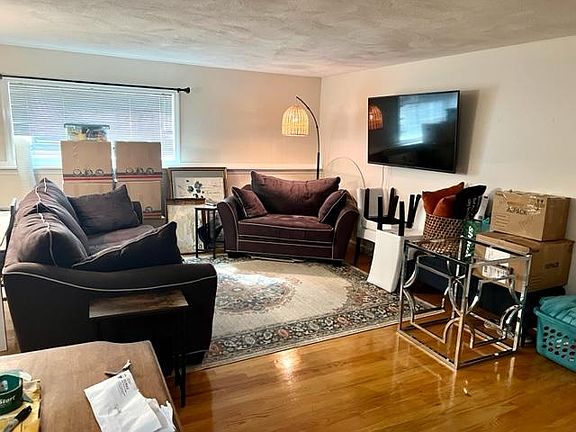 Living room with hardwood floors recently redone