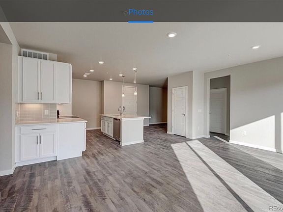 Livingrooom - shows 2nd BR on right; Master BR on left.