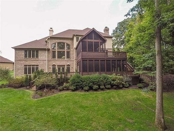 Rear view of this gorgeous home that sits in total privacy on almost 2 acres!