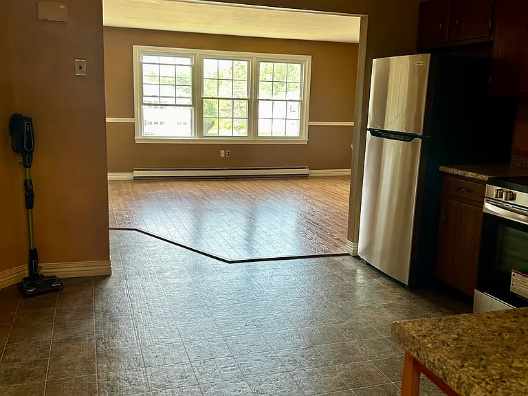 Kitchen and living room from doorway of utility room
