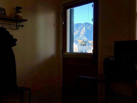 A view of the Flatirons from the living room sofa. Furniture not included.