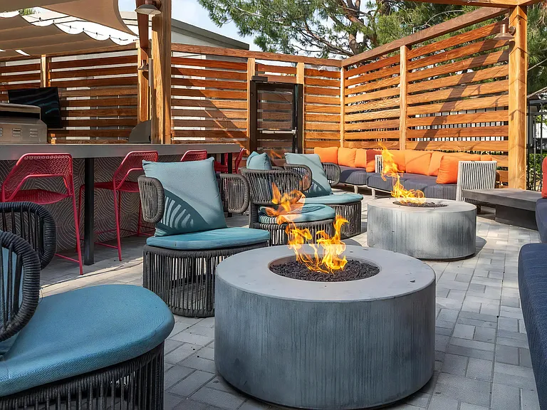 Outdoor Kitchen with Fire Pits and Couches