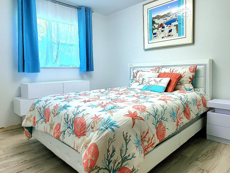 3rd Bedroom Queen size bed with lights and a a phone/tablet charger outlet. 2 Nightstands, Dresser and 50" Smart Samsung TV
