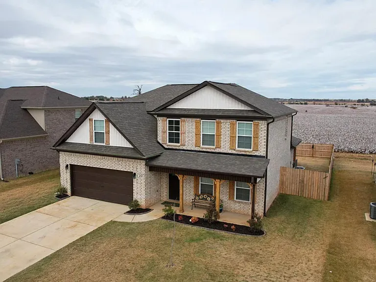 2 story house with fully fenced backyard