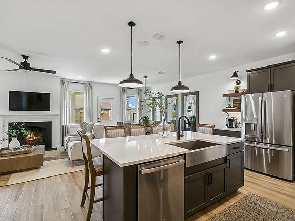Kitchen with stainless steel apron-front sink