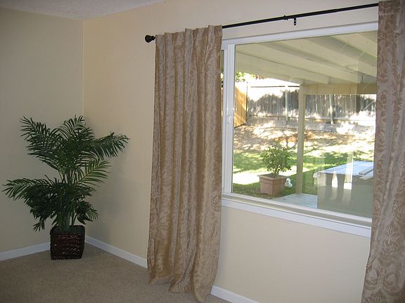 Living room with new windows and window coverings