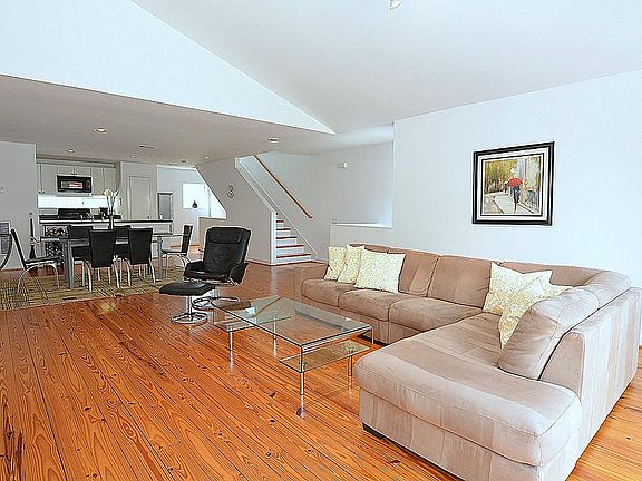 Second floor features a large open floor plan with modern architectural details, high ceilings and a