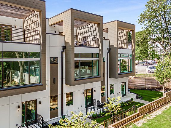 Exterior and front entrance with private fenced yard and rooftop patio