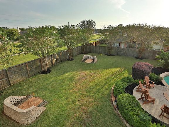 Your own horseshoe pits! And, don't miss the gate shown to the left. Once you open it, their is a sidewalk that leads to the front of the neighborhood. Makes it easy for kids to walk to Hassler elementary. Very private not having that side neighbor.