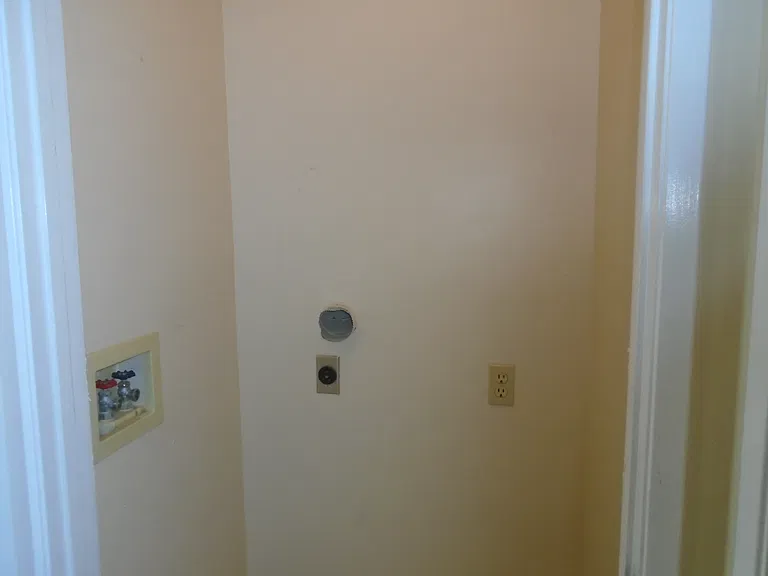 INSIDE LAUNDRY HOOK-UPS - ONE OF 2 LAUNDRY HOOK-UP AREAS
