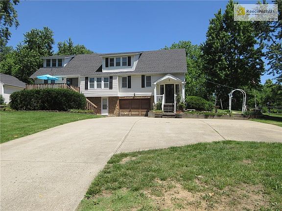 Sitting atop a hill overlooking generous space is this large home clad in steel siding renovated and expanded the  back over a period of years. First floor windows replaced.