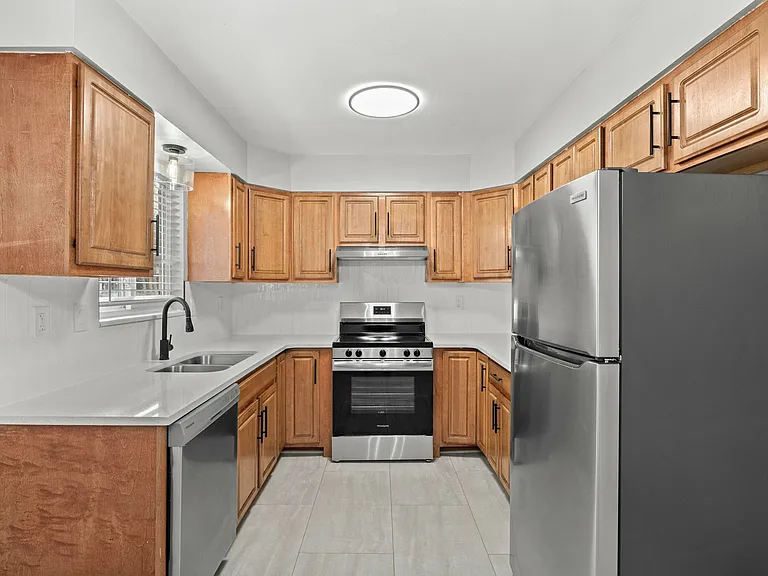 Step into a modern kitchen boasting sleek appliances and ample storage. Step into a modern kitchen boasting sleek appliances and ample storage.