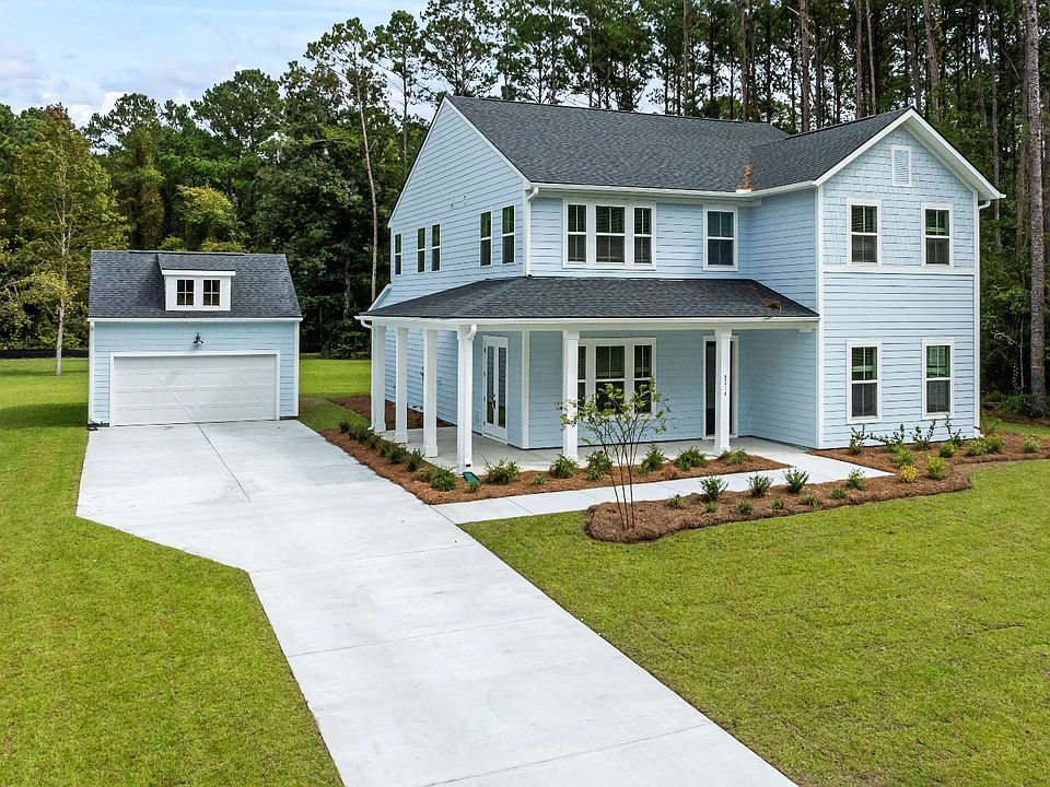 Keeneland Exterior at Pamlico Terrace at by DRB Homes features a wraparound porch in the front and a