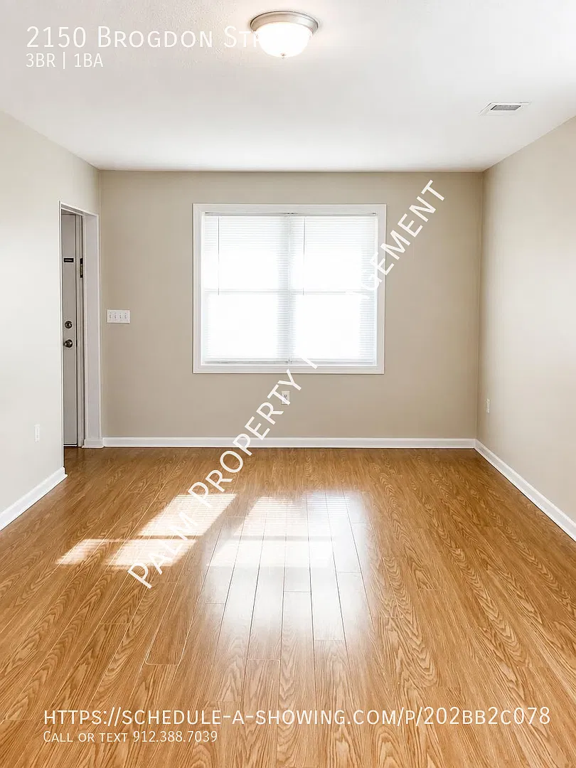 3 Bedroom, 1 Bathroom located in midtown with laminate floors, W/D Hookups and exterior storage! — Photo 3