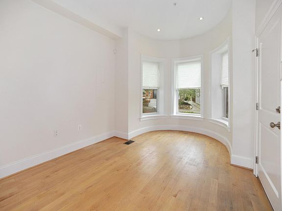 Living room with street facing nook providing abundant natural light