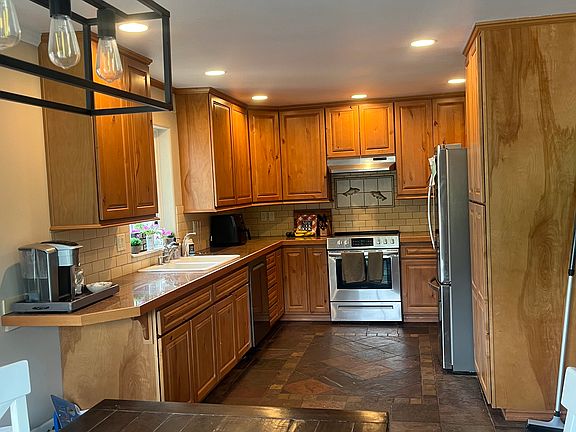 Large kitchen with newer appliances, plenty of cupboard and pantry space.