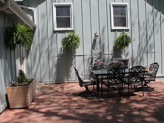 Paver patio wraps around GR