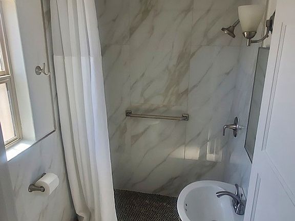 Walk in shower with safety bars and new hardware!