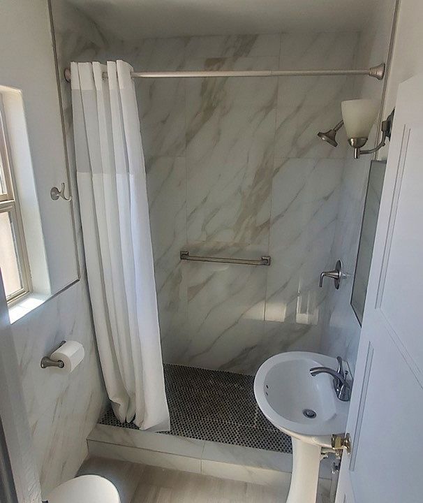 Walk in shower with safety bars and new hardware!