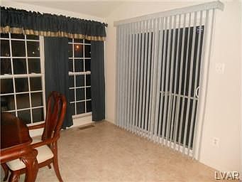 Sliders from morning room to spacious back yard.