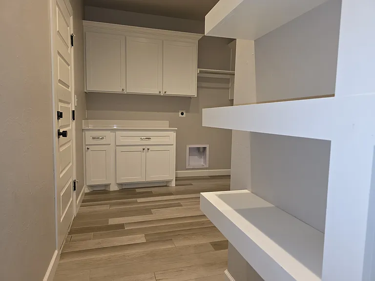 Floating storage shelves in the laundry room