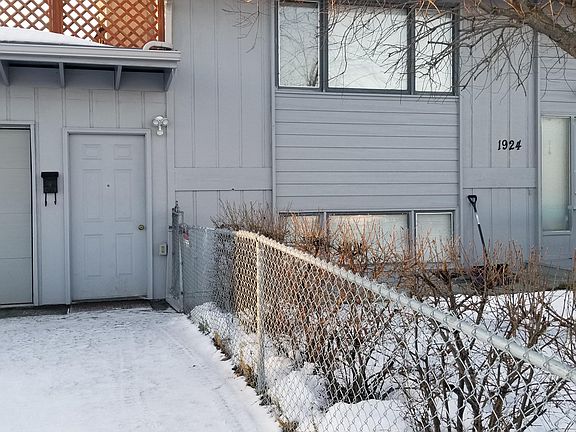 Security light above tenant private entry. Owner resides upstairs and has fenced in yard.