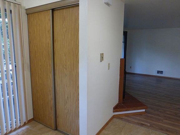 Coat closet at entry and Slider to balcony.