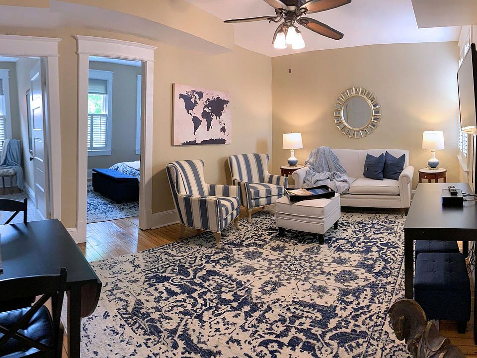 Living room with taupe walls and furnishings - furnishings not included!