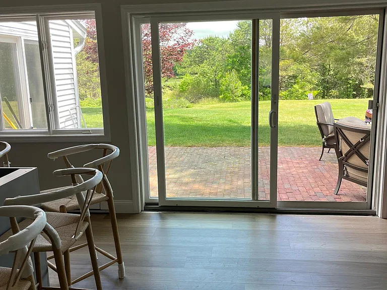 View out the back slider with golf course in the far back