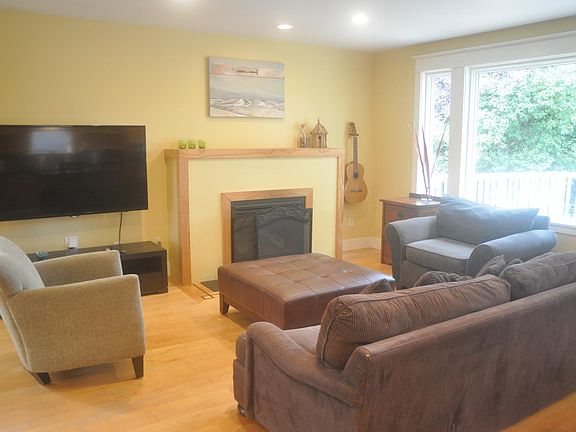 Furnished living room with fireplace, TV