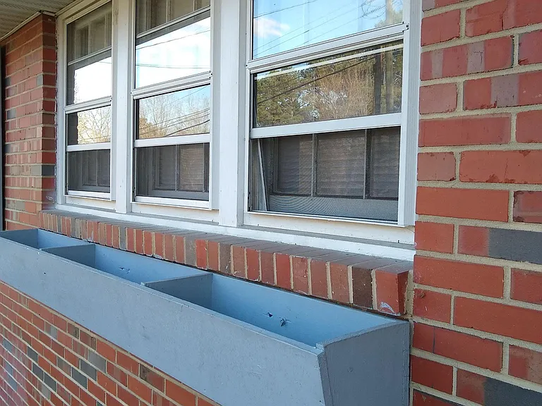 Front of house with window boxes for your plants!